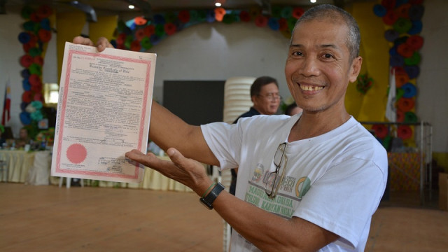 54-year-old farmer receives land title after 15 years