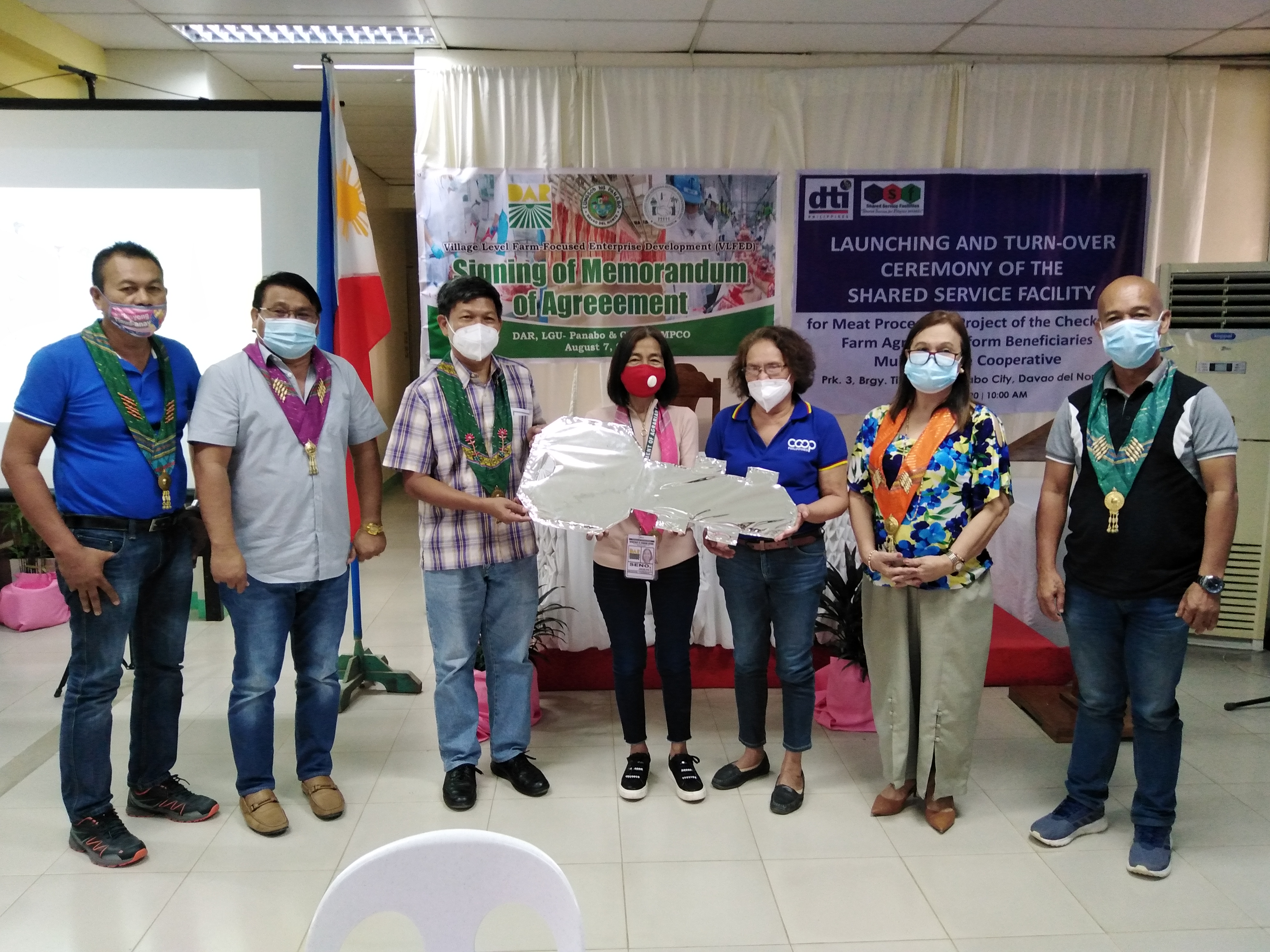 The ceremonial turn-over of key of responsibility of the P 1 Million worth of Meat Processing Plant in CFARBEMPCO, Panabo City. From left  Tibungol, Panabo City Brgy. Captain Fernando Candol, Panabo City Mayor Jose Relampagos, DTI Provincial Director Romeo Castanaga, PARPO Jocelyn Seno, CFARBEMCO Chairperson Eleuteria Chacon, DTI Asst. Regional Director Marie Ann How and City Councilor Emeterio Blase