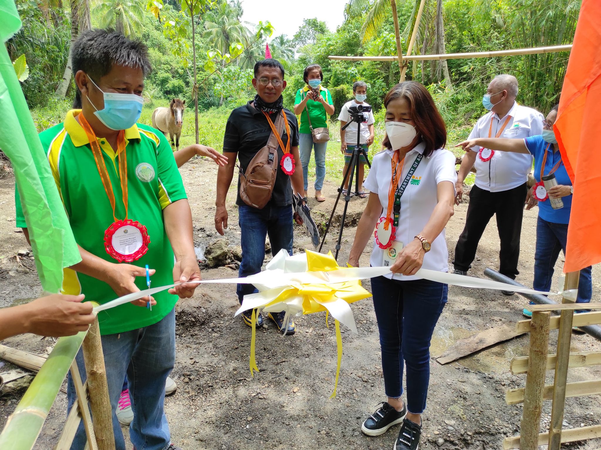 PARPO Jocelyn Seno with NJKCFO Chairperson Jhol Seguros cut the ribbon during the turn over of IRF in Kipalili, San Isidro, Davao del Norte